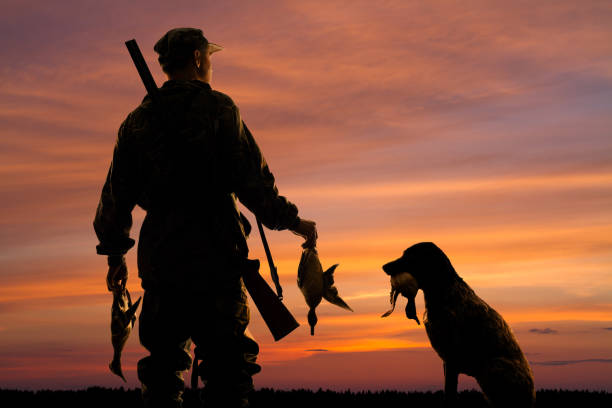 A Man and his Dog after a hunting trip.